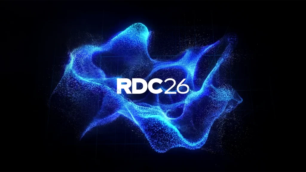 Logo RDC26 entouré de particules bleues, visuel officiel Roblox Developers Conference 2026