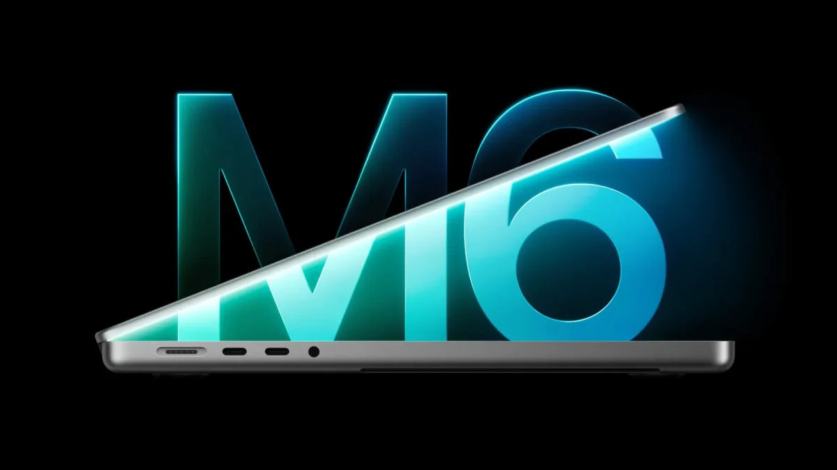 Le MacBook Pro 14 pouces avec puce M6 entrouvert devant le logo M6